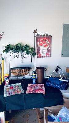 OUTSIDE SEASONAL WELCOME FLAGS, PICNIC BASKET, PESTICIDES, WALL PLANTER, AND WIND CHIME