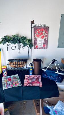 OUTSIDE SEASONAL WELCOME FLAGS, PICNIC BASKET, PESTICIDES, WALL PLANTER, AND WIND CHIME