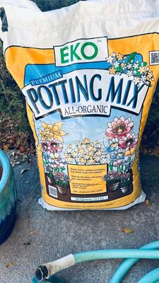 GARDEN HOSE, PLANTERS, AND POTTING SOIL