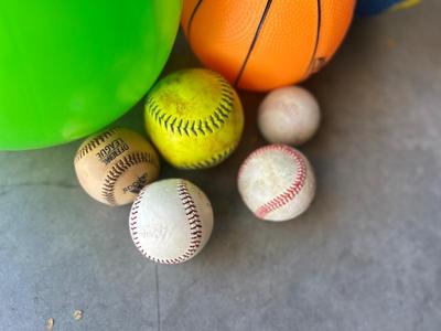 A BUCKET AND A BOX OF BALLS