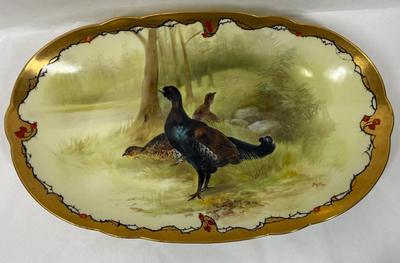 Sale Photo Thumbnail #230: Marked with the Limoges, France decorating firm '"MR France" mark, for Martial Redon, circa 1920's. Signed by the artist. 
This lovely plate features a scalloped rim with a heavy gold border. The center scene is of a male black grouse game bird watching o