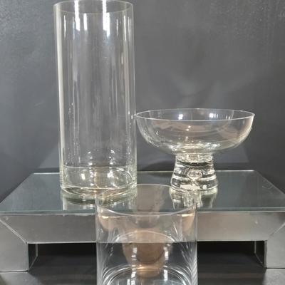 LOT 346B: Block Crystal Pedestal Bowl, Tall Glass Cylinder Vase, Smaller Glass Cylinder Bowl, and Mirror Display Shelf