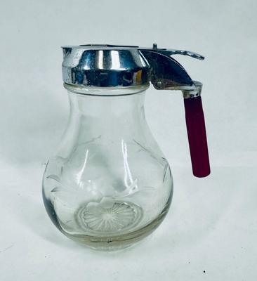 Sale Photo Thumbnail #122: Vintage Etched Floral Glass Syrup Pitcher, chrome lid with red bakelite handle.  Vintage style originally from the 1940's. Great condition.