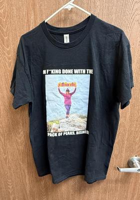 Sale Photo Thumbnail #105: Front image of a woman at a summit holding an "I DID IT" sign, back is a list of the 12 Southern California peaks climbed.  Good used condition. Made by Gildan, ultra cotton.