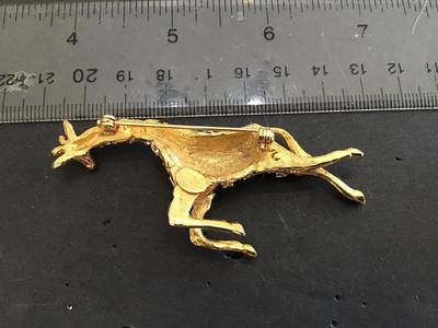 Hattie Carnegie Jumping Giraffe Brooch. Signed