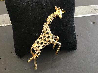 Hattie Carnegie Jumping Giraffe Brooch. Signed
