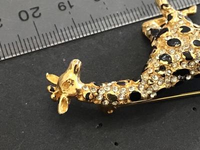 Hattie Carnegie Jumping Giraffe Brooch. Signed