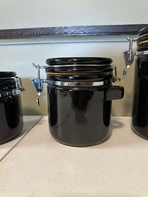 4 PIECE BLACK CERAMIC CANISTERS