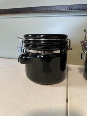 4 PIECE BLACK CERAMIC CANISTERS