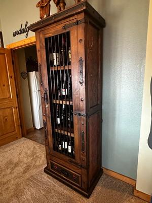 Sale Photo Thumbnail #52: Rustic Wooden Locking Wine Cabinet (Contents Not Included)  featuring a metal bar door and a bottom drawer.
M'Ments: 
Height 79"
Width 30"
Depth 18"