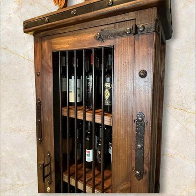 Sale Photo Thumbnail #55: Rustic Wooden Locking Wine Cabinet (Contents Not Included)  featuring a metal bar door and a bottom drawer.
M'Ments: 
Height 79"
Width 30"
Depth 18"