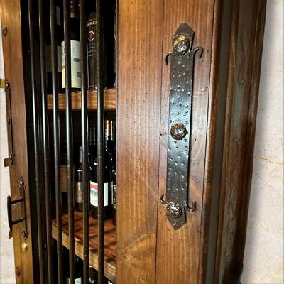 Sale Photo Thumbnail #56: Rustic Wooden Locking Wine Cabinet (Contents Not Included)  featuring a metal bar door and a bottom drawer.
M'Ments: 
Height 79"
Width 30"
Depth 18"