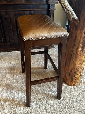 Sale Photo Thumbnail #102: Pair of Solid Wood, Brown Quilted Saddle Bar Stools with Nail Head Trim
Made in Vietnam.
Height: 30"
Seat 19" x 13"