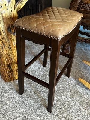 Sale Photo Thumbnail #103: Pair of Solid Wood, Brown Quilted Saddle Bar Stools with Nail Head Trim
Made in Vietnam.
Height: 30"
Seat 19" x 13"