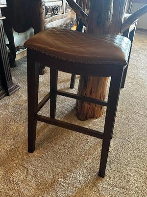 Sale Photo Thumbnail #104: Pair of Solid Wood, Brown Quilted Saddle Bar Stools with Nail Head Trim
Made in Vietnam.
Height: 30"
Seat 19" x 13"