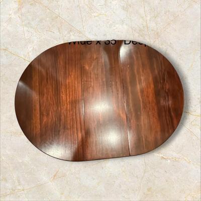 Sale Photo Thumbnail #110: Vintage Gateleg Drop Leaf Table with hinged leaves on both sides that can be raised or folded down.  The leaves are supported by extra legs that swing out.
Full m'ments:
 48" Wide
35" Deep
12" Deep with both sides down