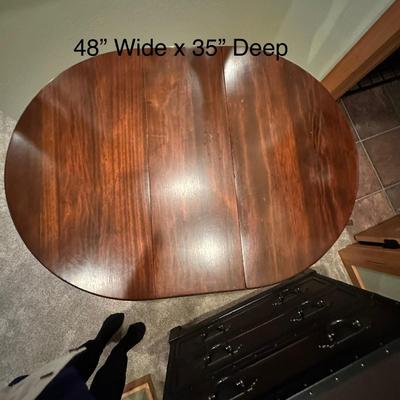 Sale Photo Thumbnail #118: Vintage Gateleg Drop Leaf Table with hinged leaves on both sides that can be raised or folded down.  The leaves are supported by extra legs that swing out.
Full m'ments:
 48" Wide
35" Deep
12" Deep with both sides down