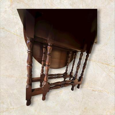 Sale Photo Thumbnail #114: Vintage Gateleg Drop Leaf Table with hinged leaves on both sides that can be raised or folded down.  The leaves are supported by extra legs that swing out.
Full m'ments:
 48" Wide
35" Deep
12" Deep with both sides down