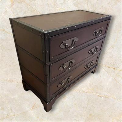Sale Photo Thumbnail #122: Trunk Style Three Drawer Accent Chest.  This Chest provides storage with a vintage look featuring faux leather accents, metal hardware and decorative studs to resemble an old travel trunk. By Sunforce Furniture. 
M'ments:
Height 32"
Width 38"
Depth 18"