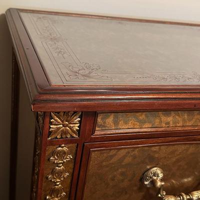 Sale Photo Thumbnail #235: Eglomise Handcrafted 3 Drawer Dresser by Theodore Alexander
Measurements: 46" WIde x 34" Tall x 20" Deep
"Eglomise" refers to a decorative technique using glass with metallic leaf applied to the reverse which Alexander used for many of his pieces.