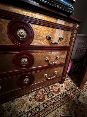 Sale Photo Thumbnail #233: Eglomise Handcrafted 3 Drawer Dresser by Theodore Alexander
Measurements: 46" WIde x 34" Tall x 20" Deep
"Eglomise" refers to a decorative technique using glass with metallic leaf applied to the reverse which Alexander used for many of his pieces.