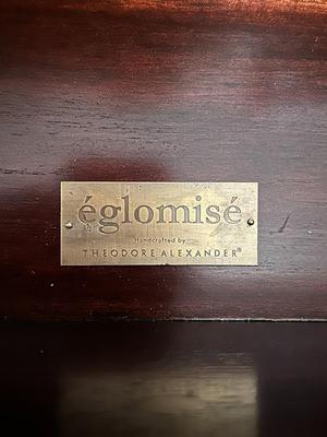 Sale Photo Thumbnail #229: Eglomise Handcrafted 3 Drawer Dresser by Theodore Alexander
Measurements: 46" WIde x 34" Tall x 20" Deep
"Eglomise" refers to a decorative technique using glass with metallic leaf applied to the reverse which Alexander used for many of his pieces.