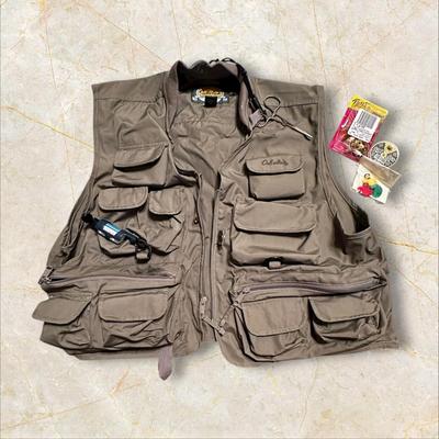 Sale Photo Thumbnail #450: Cabela's Fishing Vest with Pockets Galore +Accessories Size Large
Needs to be washed, there is some sticky unknown residue on parts of it.