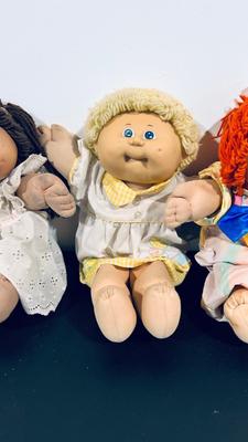 1980’S ORIGINAL CABBAGE PATCH KIDS, a BLONDE A BRUNETTE AND A GINGER HAIRED DOLLS