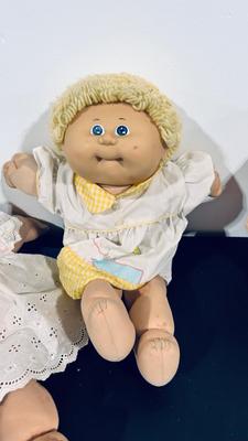 1980’S ORIGINAL CABBAGE PATCH KIDS, a BLONDE A BRUNETTE AND A GINGER HAIRED DOLLS