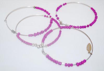 Collection of 4 PINK BANGLE BRACELETS (2¾" Opening) - with MOVEABLE Beads and 1 with LEAF Accent