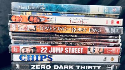 AN ASSORTMENT OF DVDS