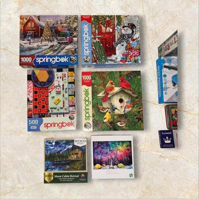 Sale Photo Thumbnail #884: Box of Puzzles, 1 Sealed
Moon Cabin Retreat is sealed and has 1000 wood pieces.