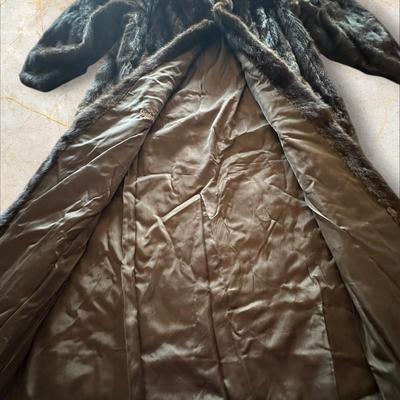 Sale Photo Thumbnail #46: Full Length Brown Mink Coat Size 14 Made in Korea
Elizabeth B Messick embroidered on interior lining.
49" long.