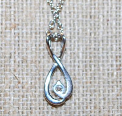 Figure "8" Symbol PENDANT (1" x ½") with a Single Clear Stone Accent on a Silver Tone Necklace Chain 18" L