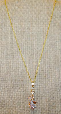Graphic Designed Flowery PENDANT (2" x ¾") with 10 Larger Round Clear Stones on a Gold Tone Necklace Chain 18" L