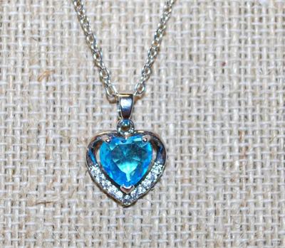 Pretty Heart Shaped Blue Faceted Stone Inside a 10 Clear Stone Silver Heart PENDANT ( ½" x ½") on a Silver Tone Necklace Chain...
