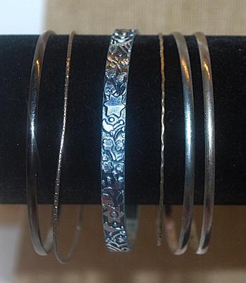 Collection of 6 Silver Colored BANGLE BRACELETS (2½" Opening) with Stars and Graphics