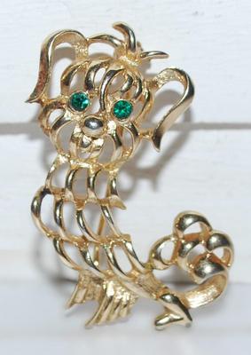 Marked "AVON" GREEN-EYED DOG BROOCH ( 1¾" x 1¼") on a Gold Tone Setting