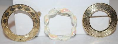 Collection of 3 CIRCLE BROOCHES (1" to 1⅛") including 1 Curled Porcelain Style