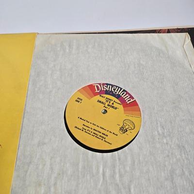 LOT 61K: Eyes and Ears 1986, 87, and 88 Copies, It's a Small World and Haunted House Albums, Mickey Mouse Figurine, and 2 Button Pins