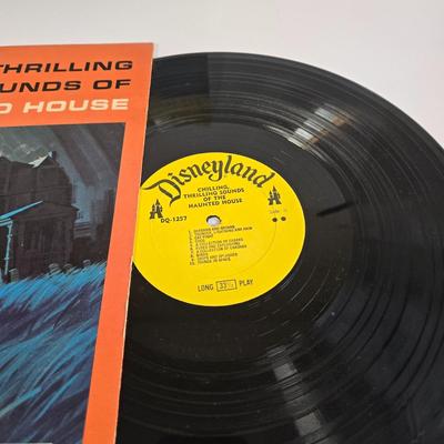 LOT 61K: Eyes and Ears 1986, 87, and 88 Copies, It's a Small World and Haunted House Albums, Mickey Mouse Figurine, and 2 Button Pins