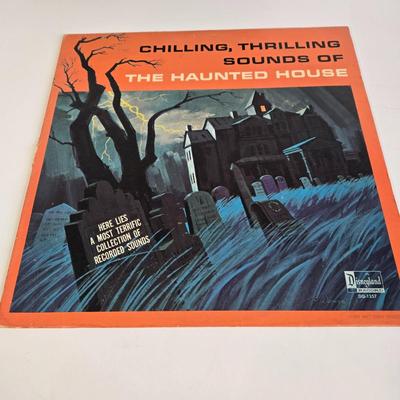 LOT 61K: Eyes and Ears 1986, 87, and 88 Copies, It's a Small World and Haunted House Albums, Mickey Mouse Figurine, and 2 Button Pins