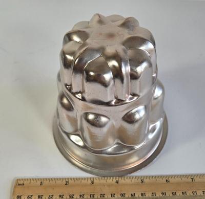 LOT 73K: Jello Molds, Cast Iron Trivet, Progressive Mortar & Pestle Set, Vintage Rosette Irons, and More