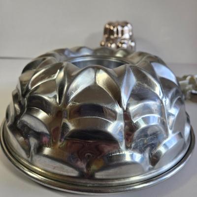 LOT 73K: Jello Molds, Cast Iron Trivet, Progressive Mortar & Pestle Set, Vintage Rosette Irons, and More