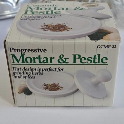 LOT 73K: Jello Molds, Cast Iron Trivet, Progressive Mortar & Pestle Set, Vintage Rosette Irons, and More