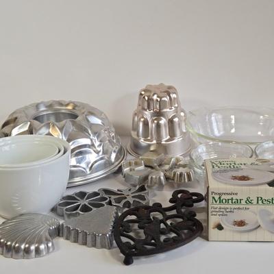 LOT 73K: Jello Molds, Cast Iron Trivet, Progressive Mortar & Pestle Set, Vintage Rosette Irons, and More