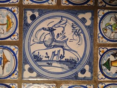 Sale Photo Thumbnail #8: Charming antique hand painted tiles of animals, buildings, trees in Medieval style. Wear corresponding to age. Nice golden color to wood. 22 1/2" W x 22 1/2" D x 22 1/2" H. Loose trim piece from underside included.