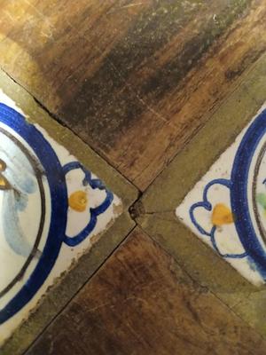 Sale Photo Thumbnail #13: Charming antique hand painted tiles of animals, buildings, trees in Medieval style. Wear corresponding to age. Nice golden color to wood. 22 1/2" W x 22 1/2" D x 22 1/2" H. Loose trim piece from underside included.