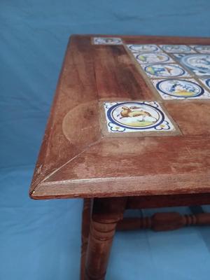 Sale Photo Thumbnail #11: Charming antique hand painted tiles of animals, buildings, trees in Medieval style. Wear corresponding to age. Nice golden color to wood. 22 1/2" W x 22 1/2" D x 22 1/2" H. Loose trim piece from underside included.