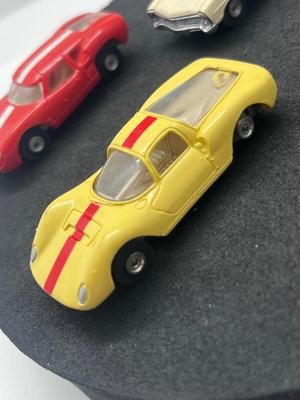 LOT 83: Vintage Aurora "Cigar Box" Cars - Ford "J", Dino Ferrrari, Lola GT and Ford XL 500